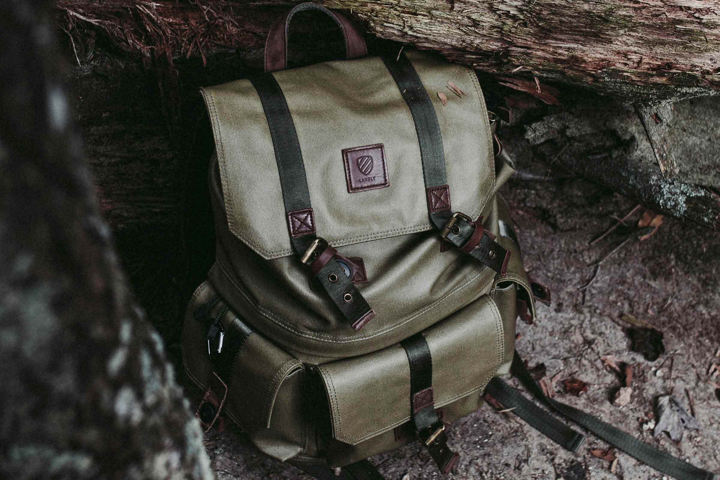 A green emergency backpack on the ground